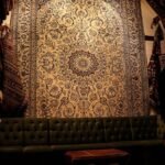 a living room with a couch and rugs
