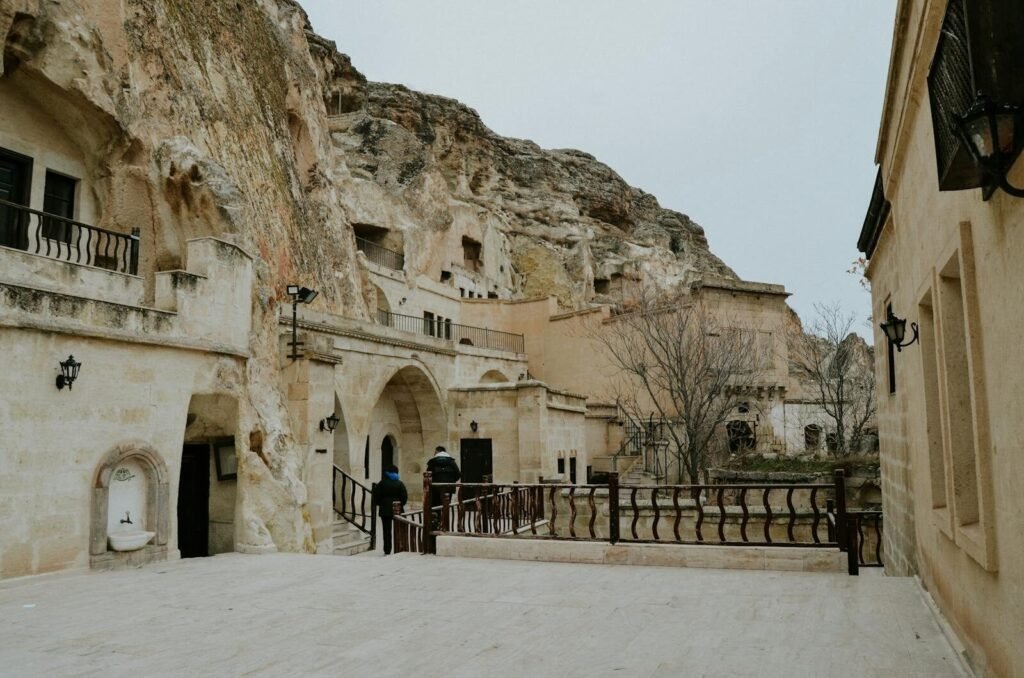 Explore the unique cave houses carved into rock formations in Cappadocia, Nevşehir, Türkiye.