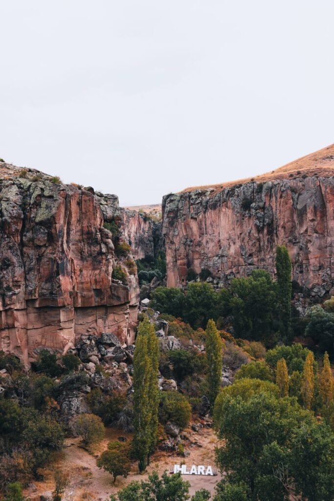 Explore the stunning landscapes of Ihlara Valley with its towering cliffs and lush greenery.