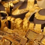 a bunch of gold bracelets are on display